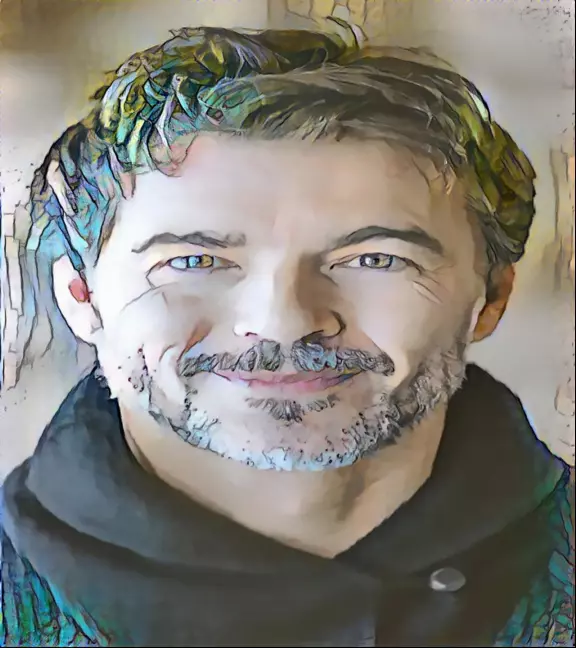 Handsome smiling fellow with trim hair, short beard and moustache, just a hint of gray.